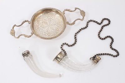 Lot 798 - Silver tea strainer together with two silver mounted glass scents