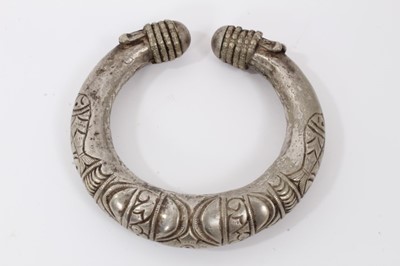 Lot 803 - North African silver torque, decorated with fish and geometric motifs, 10cm wide