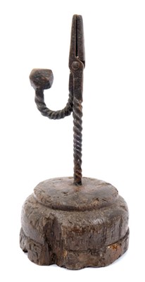 Lot 821 - 18th century wrought iron nip rush light holder, raised on circular oak base