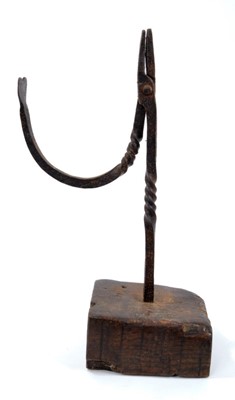 Lot 823 - 18th century wrought iron nip rush light holder