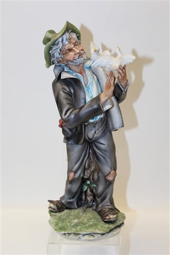Lot 1088 - Capodimonte figure - Man with bird - with...
