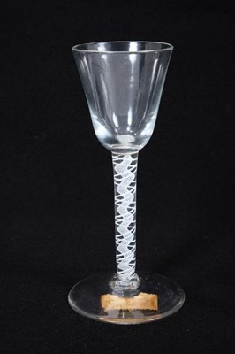 Lot 1922 - Georgian double series opaque twist wine glass, c.1765, with round funnel bowl and conical foot, 14.75cm high