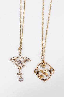 Lot 511 - Two Edwardian gold and gem set pendants with openwork floral plaques on chains