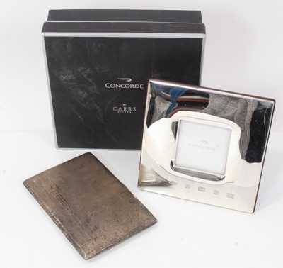 Lot 1961 - George VI silver cigarette case of rectangular form with engine turned decoration, (London 1945), together with a Contemporary silver 'Concorde' photograph frame in original box, (Sheffield 2003) (...