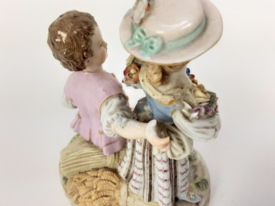 Lot 1932 - Meissen porcelain group, late 19th century, the boy sat on a sheaf of wheat, listening to a girl playing the lute, marks to base, 15cm high