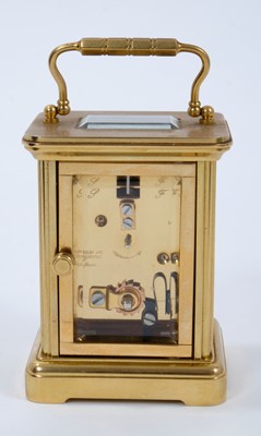 Lot 661 - Halcyon Days miniature enamel carriage clock with floral decoration on blue ground, 7.5cm high