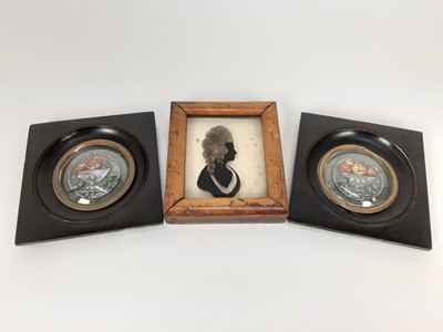 Lot 1950 - Pair of 19th century floral ornaments, made of glass beads and paper, in ebonised frames measuring 12cm across, and a 19th century reverse-glass painted silhouette in maple frame (3)