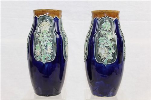 Lot 1097 - Two Edwardian Royal Doulton vases with green...