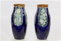 Lot 1097 - Two Edwardian Royal Doulton vases with green...