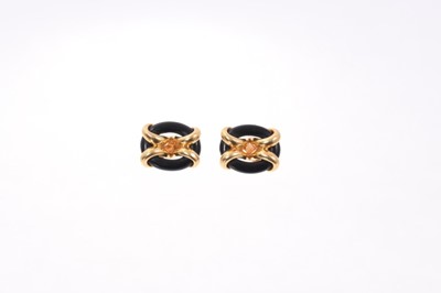 Lot 568 - Pair of gold and ebony earrings, the oval hoop with 18ct yellow mounts with clip fittings.