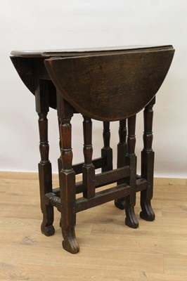 Lot 1527 - Small late 17th / early  18th century oak gateleg table on turned supports joined by stretchers on scroll feet