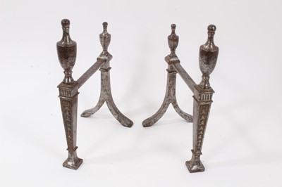 Lot 893 - Pair of Georgian steel fire dogs with Adams style decoration, 27.5cm in height