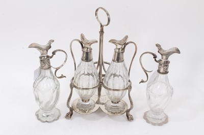 Lot 433 - George III silver 3 bottle cruet frame of trefoil form, with a pair of bottles and two others