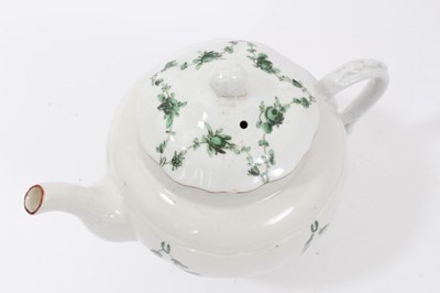 Lot 192 - Bristol ogee shaped teapot and cover, circa 1772, with green-painted swags of flowers, the spout and rim of cover painted red, marks to base, 15.5cm high