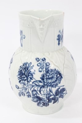 Lot 194 - Worcester cabbage leaf moulded mask jug, circa 1770, decorated with flowers, 20cm high
