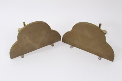 Lot 896 - Pair of painted wooden Colefax and Fowler wall brackets each with trefoil form shelf on scrolling supports, 27cm wide. From a commission by Lord and Lady David Cholmondeley