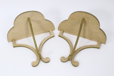 Lot 896 - Pair of painted wooden Colefax and Fowler wall brackets each with trefoil form shelf on scrolling supports, 27cm wide. From a commission by Lord and Lady David Cholmondeley