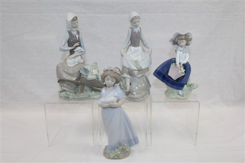 Lot 1109 - Four Lladro figures - to include girl with...