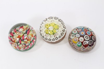 Lot 904 - Three 20th century cane paperweights, including one Murano