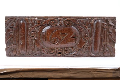 Lot 907 - 17th century carved oak plaque, dated 1674, 39cm long