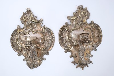 Lot 908 - Pair of 19th century silvered rococo style wall sconces, cartouche form with projecting scrolled candle arm, 33cm high