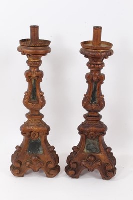 Lot 910 - Pair of 19th century Italian carved altar candlesticks, 44cm high