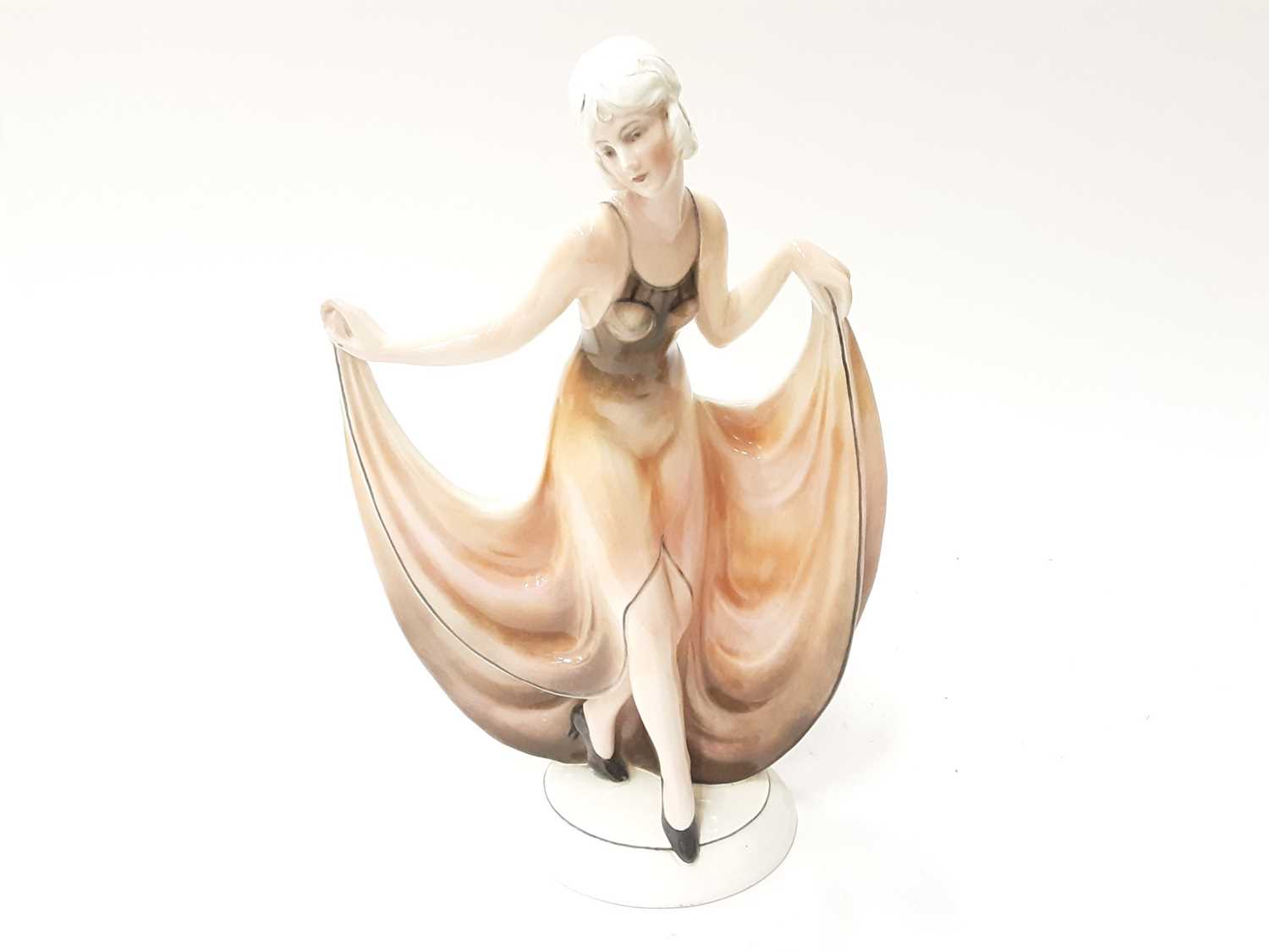 Lot 1149 - Stylish German pottery figure of a 1930's lady, 32cm high