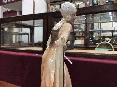 Lot 1149 - Stylish German pottery figure of a 1930's lady, 32cm high