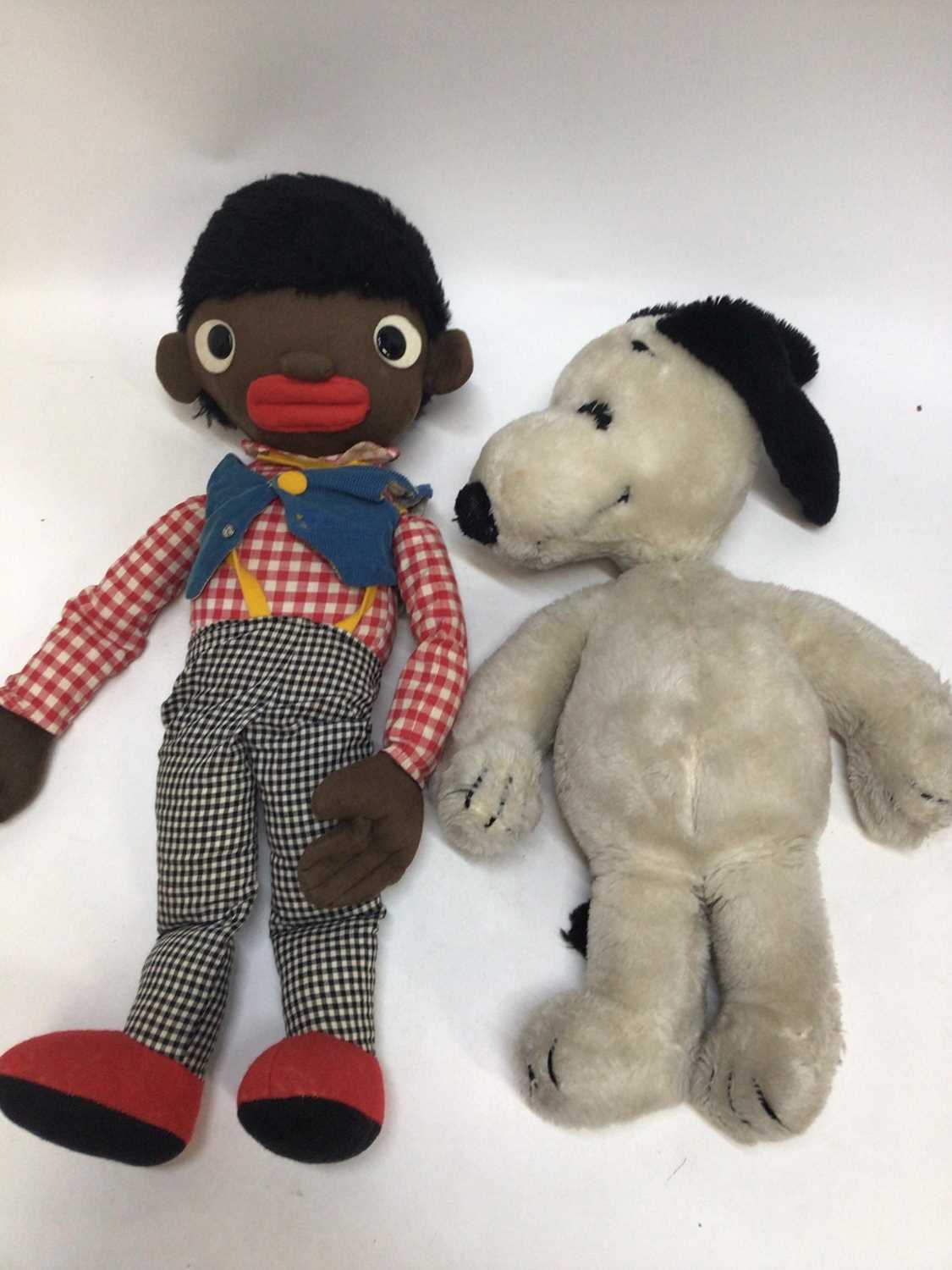 Lot 2441 - Steiff Rabbit, Steiff Cat both with ear buttons, Snoopy Dog (large and small) and two Golly soft toys