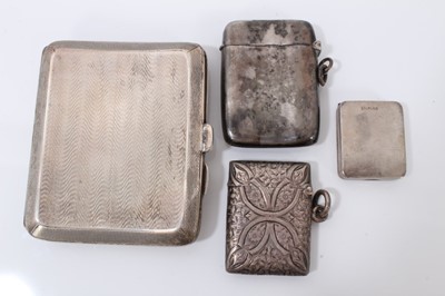 Lot 110 - 1930s silver cigarette case, two silver vesta cases and a silver stamp case (4)