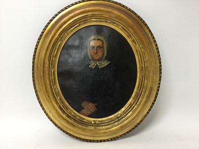 Lot 95 - English School, mid 19th century, oil on canvas, oval, portrait of an austere woman with glasses and white bonnet, 26 x 22cm, gilt frame