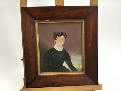 Lot 99 - English School, circa 1820, oil on board, half length portrait of a lady, in period glazed rosewood frame