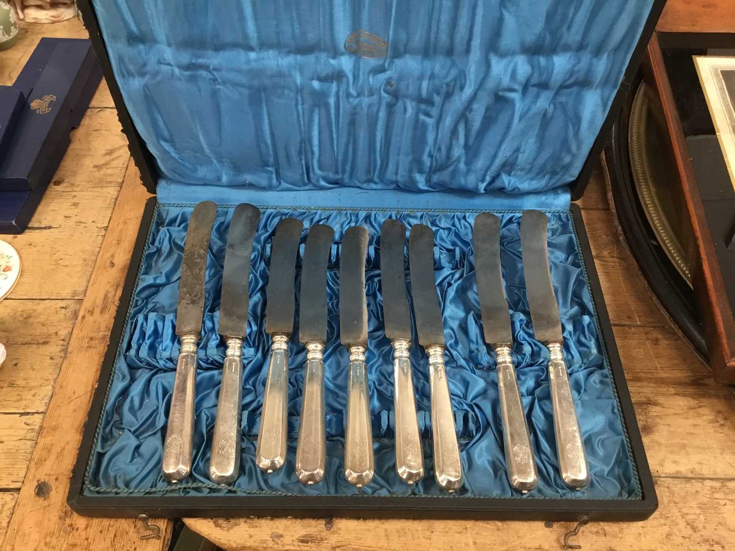 Lot 77 - Set of twelve 19th century Continental white metal dinner knives with steel blades in fitted case