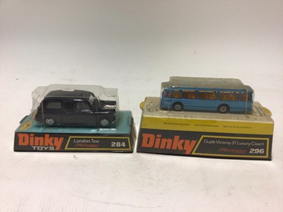 Lot 2355 - Dinky London Taxi No.284, Duple Viceroy 37 luxury coach No.296 in original blister packs (2)