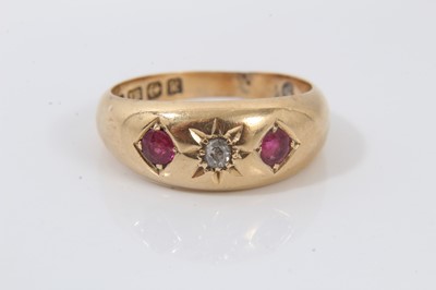 Lot 564 - Edwardian 18ct ruby and diamond three stone gypsy ring