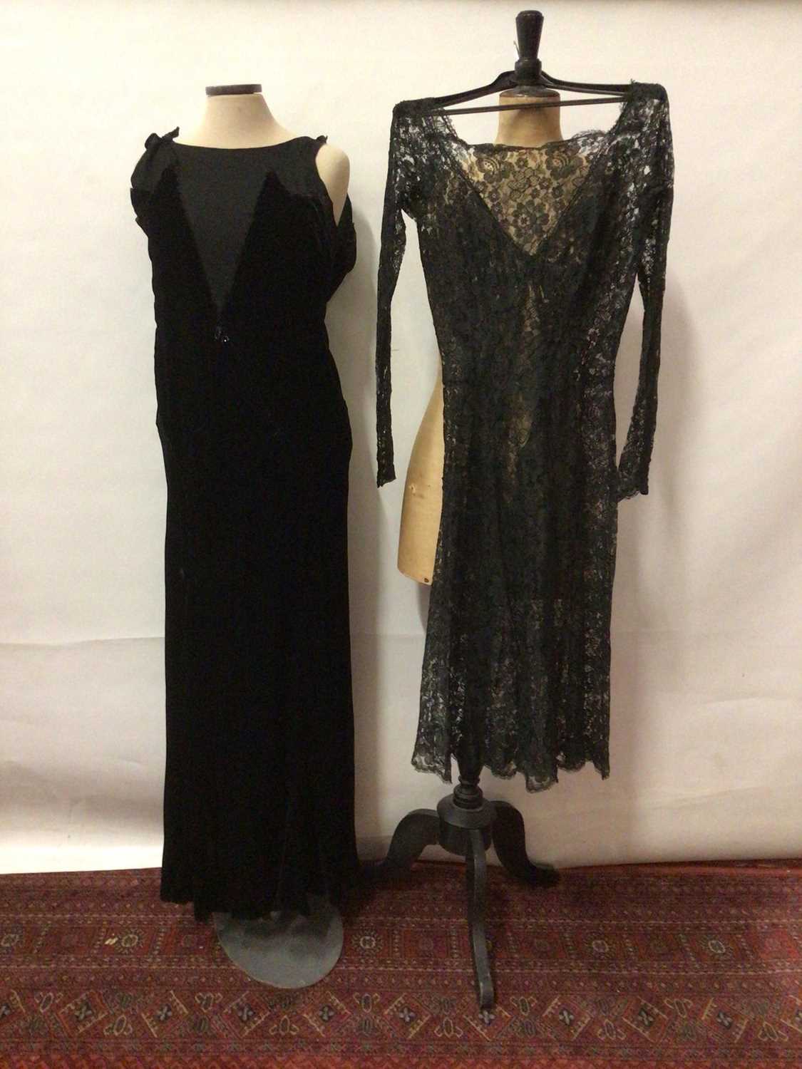 Lot 2055 - 1920 Black velvet evening dress, bias cut and silk crepe panels to bodice.  Plus an all over black lace evening dress with long sleeves and buttoned cuff.