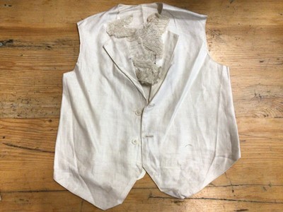 Lot 2060 - Edwardian accessories including a pair of fine lawn detachable sleeves with lace cuffs, tape lace blouse, child's chamios leather waistcoar, child's linen waistcoat with lace trim, pair of silk sto...