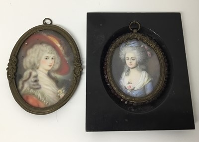 Lot 245 - 18th century style portrait miniature on ivory depicting a lady in blue dress, signed with initials AB, oval, 7 x 6cm, glazed metal frame suspended from ebonised frame, together with a similar 18th...