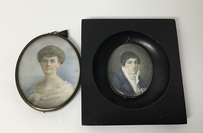 Lot 247 - 18th century portrait miniature on ivory, depicting a Gentleman in blue coat and white cravat, oval, 6 x 5cm, together with an early 20th century portrait miniature of a lady named verso as Catheri...