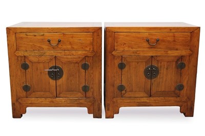 Lot 1456 - Pair of Chinese elm bedside tables with single drawer and cupboard below with brass handles, 63cm wide.