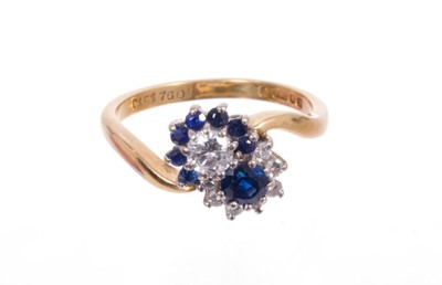 Lot 542 - Sapphire and diamond cluster ring with a double cluster