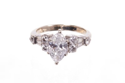 Lot 553 - Diamond single stone ring with a marquise cut diamond weighing approximately 0.97cts. together with a wedding ring