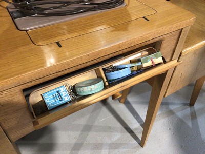 Lot 991 - Singer electric sewing machine in light oak cabinet and a similar needle work box with contents