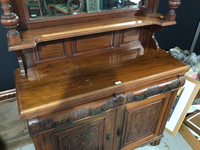 Lot 993 - Edwardian carved walnut two height sideboard with bevelled mirror back H192.5, W124, D46cm