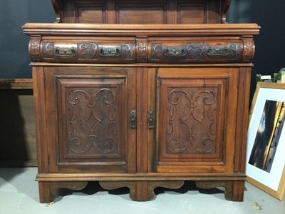 Lot 993 - Edwardian carved walnut two height sideboard with bevelled mirror back H192.5, W124, D46cm