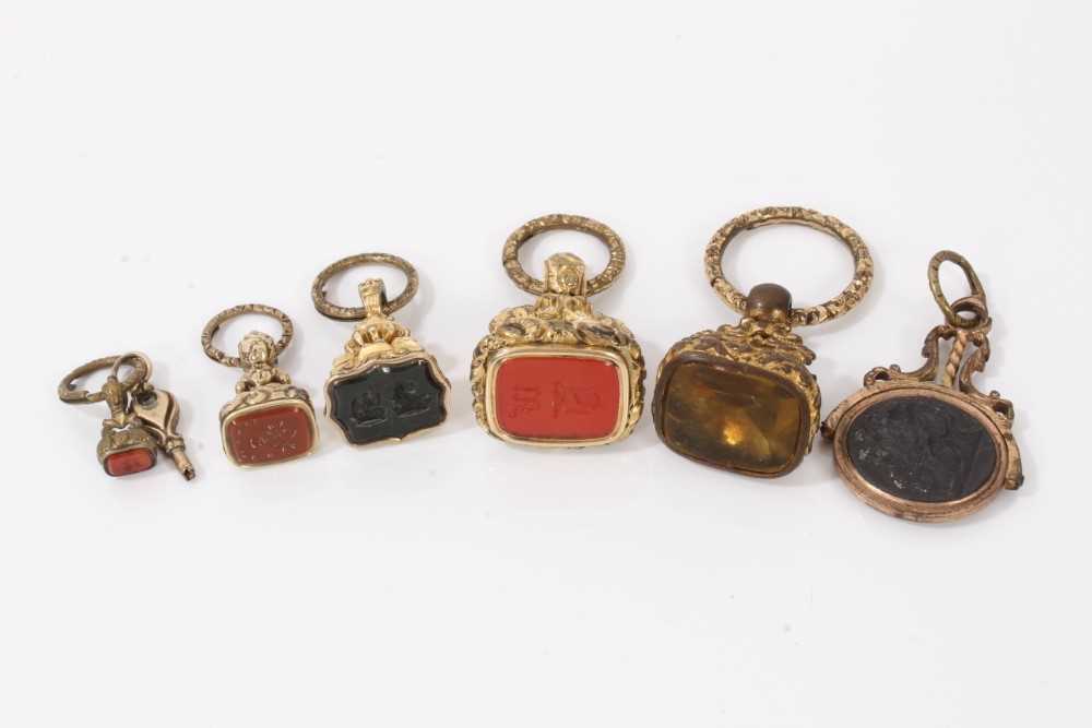 Lot 7 - Collection of six antique hard stone seals in gilt metal mounts