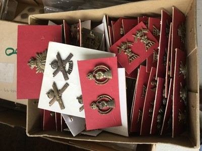 Lot 792 - Collection of British Military cap and uniform badges to include 12th Lancers, Essex Regiment, Royal Armoured Corp and others on cardboard backed sheets (qty)