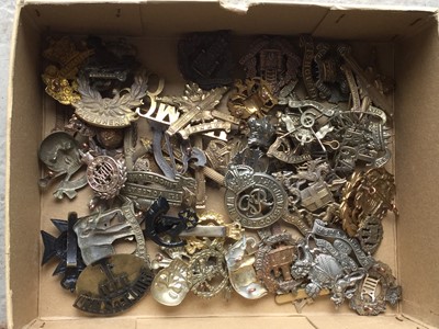 Lot 794 - Collection of approximately 50 British Military cap badges including Machine Gun Corps, The Essex Regiment and The Royal Irish Regiment (some copies noted)