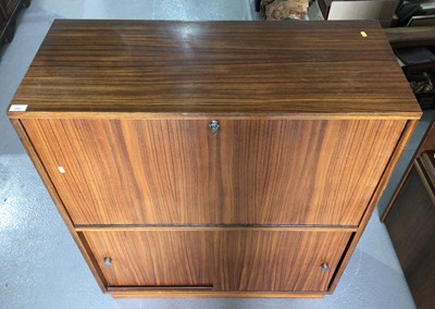Lot 1001 - Mid century rosewood drinks cabinet on plinth base