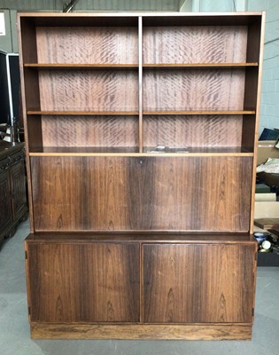 Lot 1002 - Mid century Danish rosewood two height bookcase with open shelves, fall flap enclosing stationary compartment above and two panelled cupboard doors below